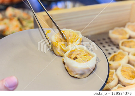 Asian traditional food. Korean style dumplings Asian traditional food. Korean style dumplings 129584379