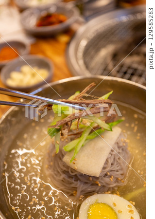 Korean traditional food. Cold buckwheat noodles Korean traditional food. Cold buckwheat noodles 129585283