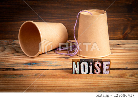 Vintage Toy Phone with Noise Concept Highlighting Disruption in Communication Vintage Toy Phone with Noise Concept Highlighting Disruption in Communication 129586417