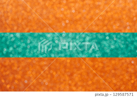 Colorful orange and mint green glitter large bokeh background for music cabaret showgirl design textures Colorful orange and mint green glitter large bokeh background for music cabaret showgirl design textures 129587571