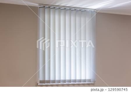 Closed Vertical Blinds in Minimalist Interior 129590745