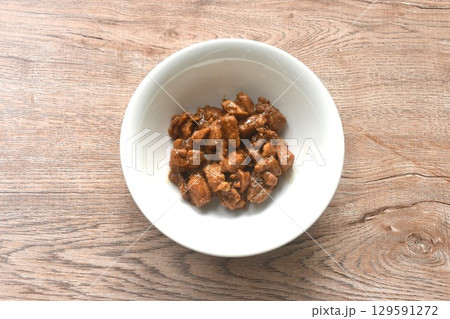 salty boiled slice dice pork meat in soy sauce on bowl 129591272