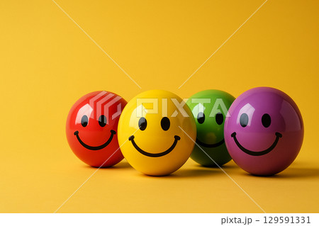 Playful arrangement of cheerful spheres in varied colors symbolizing the balance and interconnectedness of diversity, inclusion, and equity in group dynamics 129591331