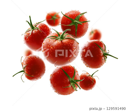 Red tomatoes levitate on a white background Red tomatoes levitate on a white background 129591490