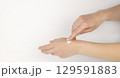 Hand with cream. Gentle female hands. Concept of skin care and cosmetic products. 129591883