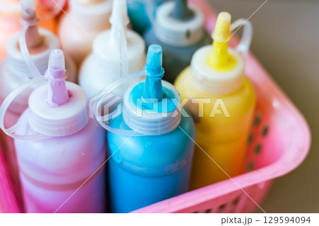 Close up transparent bottle acrylic paint 129594094