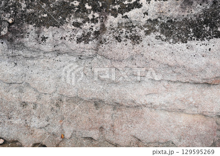 Natural stone wall with wavy Cross-Bedding texture and black stains spot Natural stone wall with wavy Cross-Bedding texture and black stains spot 129595269
