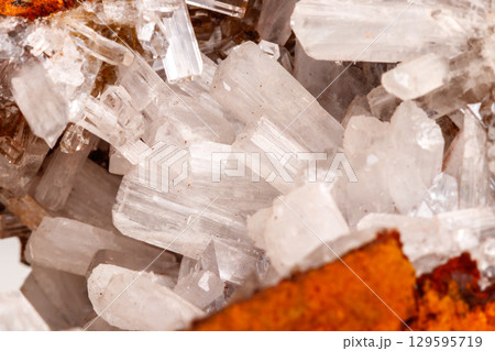 Macro mineral stone crystals Hemimorphite rock on a white background 129595719