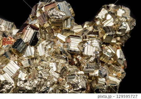 Macro mineral stone Pyrite on a black background Macro mineral stone Pyrite on a black background 129595727