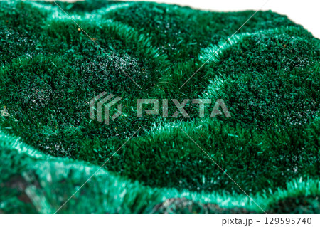 Macro mineral stone plisoviy, plush, satin malachite on a white background 129595740