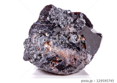 macro mineral stone sherle, schorl, black tourmaline on white background macro mineral stone sherle, schorl, black tourmaline on white background 129595745