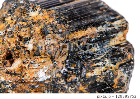 macro mineral stone sherle, schorl, black tourmaline on white background 129595752