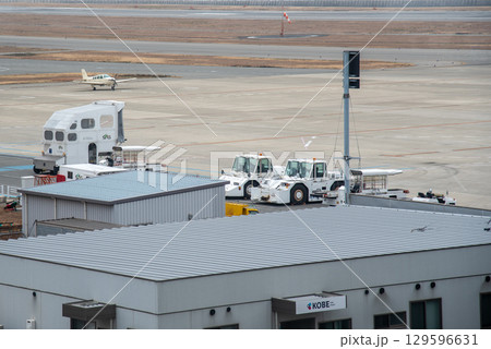 Runway of Kobe airport, domestic airport on an artificial island just off the coast of Kobe, Hyogo prefecture of Japan Runway of Kobe airport, domestic airport on an artificial island just off the coast of Kobe, Hyogo prefecture of Japan 129596631
