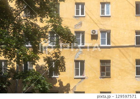 Air conditioners are installed on facade of building. device for comfortable living in hot weather. Air conditioners are installed on facade of building. device for comfortable living in hot weather. 129597571