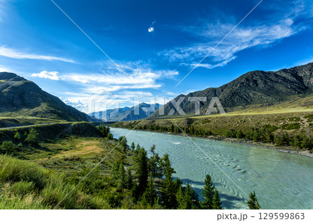 A river in the mountains on a clear sunny day 129599863