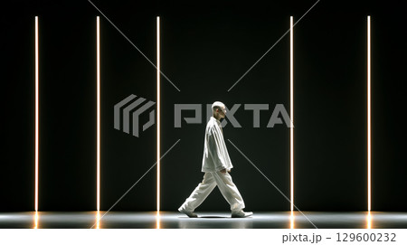 Male model walking confidently on the catwalk during a vibrant fashion show, illuminated by striking vertical lights and exuding elegance Male model walking confidently on the catwalk during a vibrant fashion show, illuminated by striking vertical lights and exuding elegance 129600232