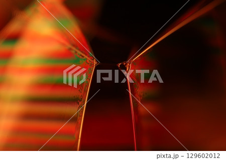 Orange coloured liquid surface, fluid effect, bright chemistry, geometric shapes 129602012