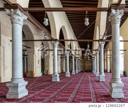 Grand interior of Al-Zahir Baybars Mosque, Cairo, Egypt, with ornate columns, arches, and hanging lamps 129602267