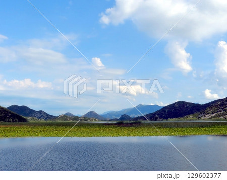 Breathtaking Views of Skadar Lake in Montenegro With Lush Greenery and Distant Mountains Breathtaking Views of Skadar Lake in Montenegro With Lush Greenery and Distant Mountains 129602377