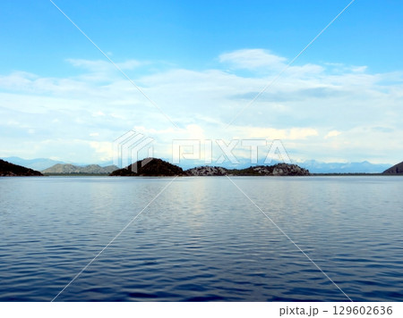 Exploring the Serene Beauty of Skadar Lake in Montenegro Amid Tranquil Waters and Rolling Hills Exploring the Serene Beauty of Skadar Lake in Montenegro Amid Tranquil Waters and Rolling Hills 129602636