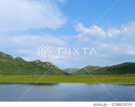 Breathtaking Views of Skadar Lake in Montenegro Showcasing Natures Beauty During a Serene Day 129602659