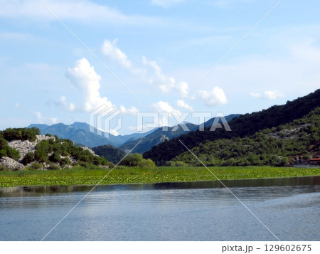 Breathtaking Views of Skadar Lake in Montenegro With Lush Landscapes and Distant Mountains 129602675