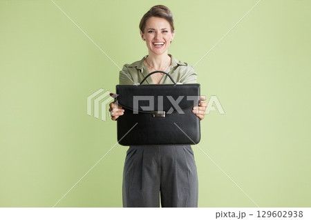 Happy businesswoman with briefcase 129602938