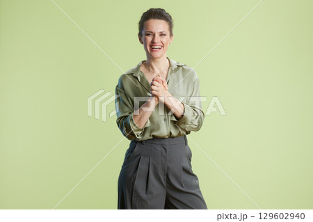 Cheerful Professional: Woman in Green Shirt 129602940