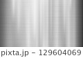Brushed Metal Texture Background with Vertical Light Reflections 129604069