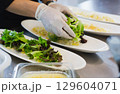 Professional food preparation and healthy eating concept 129604071