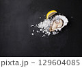 Oyster on a bed of salt 129604085