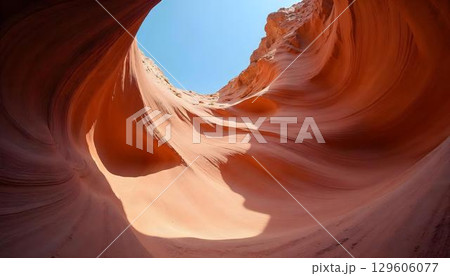 A serene desert canyon at sunset, where the sun's warm glow enhances the beauty of the rugged landscape 129606077