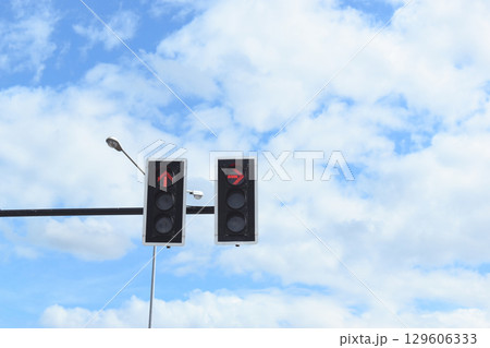 traffic light on beautiful blue sky and white cloud, nature scene in the city 129606333