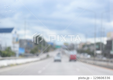 highway traffic with safety barrier on road asphalt, blurred image highway traffic with safety barrier on road asphalt, blurred image 129606336