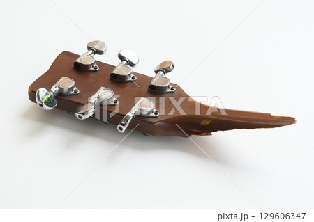 part of broken wood acoustic guitar isolated on white background part of broken wood acoustic guitar isolated on white background 129606347