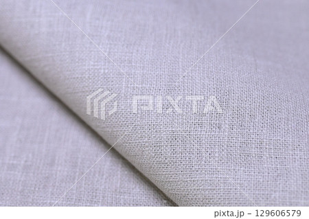 beige hemp viscose natural fabric cloth color; sackcloth rough texture of textile fashion 129606579