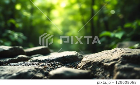 A close-up of a translucent rock illuminated by sunlight, set against an earthy background, symbolizing Earth day 129608068
