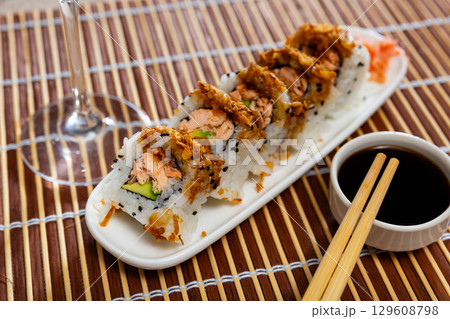 Set of rolls with fish and vegetables with Chinese chopsticks Set of rolls with fish and vegetables with Chinese chopsticks 129608798