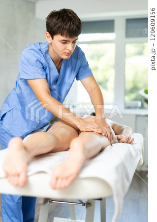 Rehabilitation course leg massage 129609156