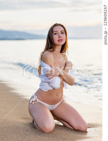 Woman in bikini enjoying tropical beach and caribbean summer vacation 129609287