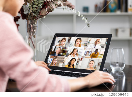 Young woman holding a video conference online on internet 129609443