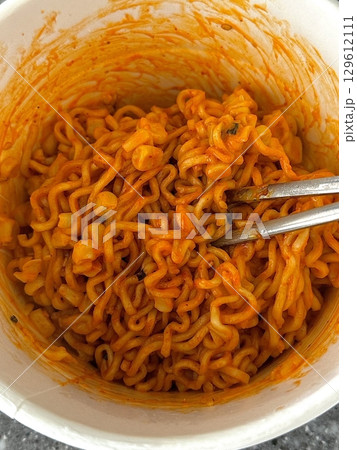 Spicy buldak ramyeon with fiery hot sauce and chewy noodles, delivering an intense, flavorful kick in every bite. A perfect choice for those who crave bold, spicy Korean comfort food. 129612111