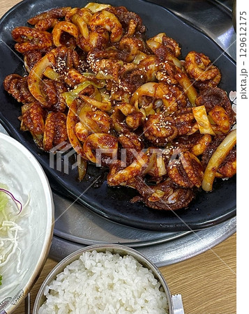 Spicy stir-fried jjukkumi (baby octopus) coated in a rich, flavorful gochujang-based sauce. This Korean dish is bold, chewy, and perfect for seafood lovers craving heat. Spicy stir-fried jjukkumi (baby octopus) coated in a rich, flavorful gochujang-based sauce. This Korean dish is bold, chewy, and perfect for seafood lovers craving heat. 129612175