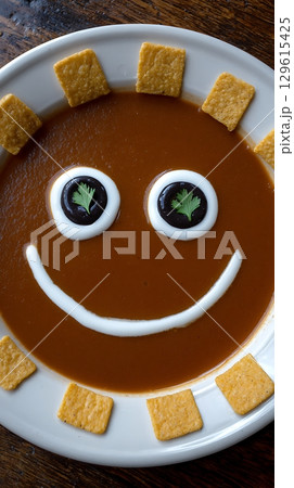 Happy Face Soup with Crackers a Fun Meal for Kids. 129615425