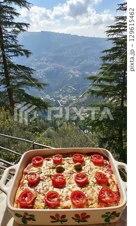 Delicious Homemade Pizza with a Scenic Mountain View Backdrop. Delicious Homemade Pizza with a Scenic Mountain View Backdrop. 129615462