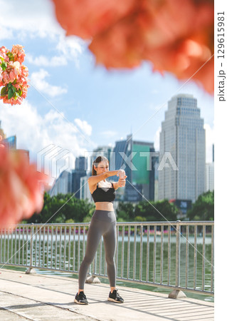 Southeast asian female stretching arm before exercise workout fitness woman wear sports outfit 129615981