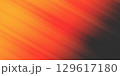Abstract orange and red gradient background with grainy texture. 129617180