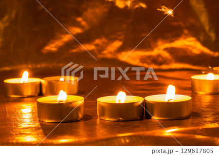 Candles New Year sparkle in the dark, bringing hope 129617805