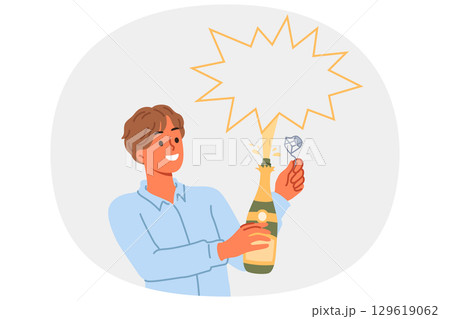 Man opens champagne and sees splash of alcoholic drink during festive christmas party 129619062