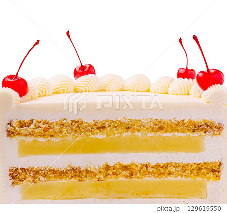 Delicious layered cake with cherries and cream on a bright background Delicious layered cake with cherries and cream on a bright background 129619550